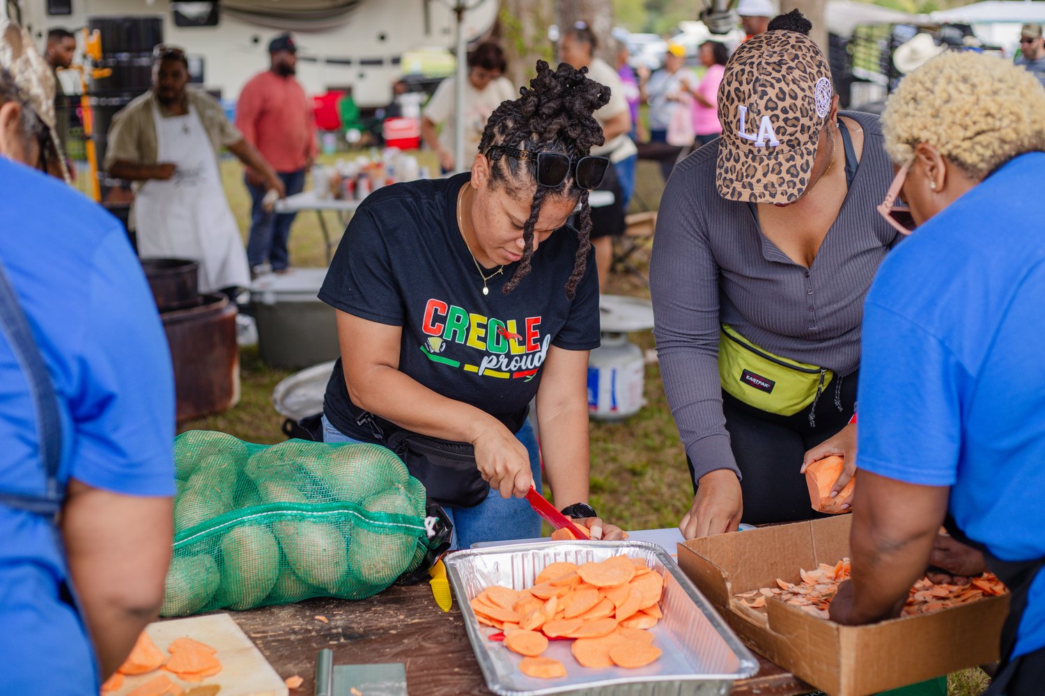 Families preparing food to share free with the public